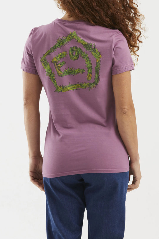 Person wearing a purple t-shirt with a green logo on the back, standing against a white background