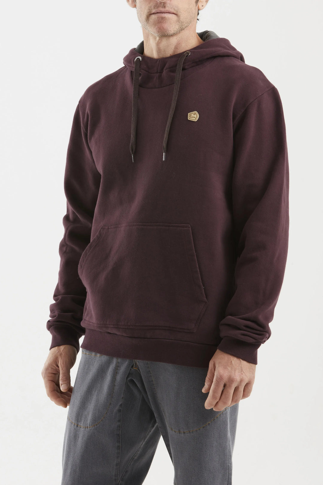 Man wearing a maroon hoodie with a small e9 logo on a white background