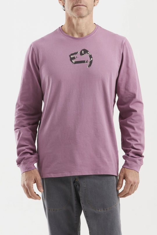 Person wearing a purple long-sleeve shirt with a logo on a white background